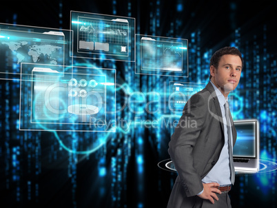 Composite image of serious businessman with hands on hips