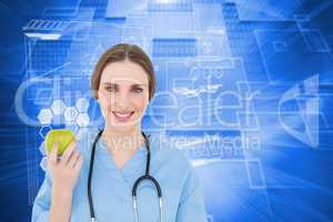 Composite image of young woman doctor holding a green apple