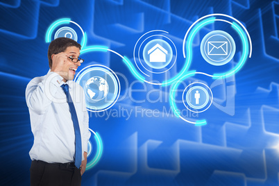 Composite image of thinking businessman tilting glasses Composite image of thinking businessman tilting glasses