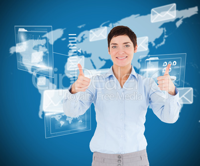 Composite image of businesswoman with the thumbs up