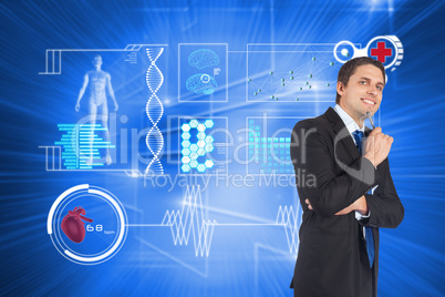 Composite image of thinking businessman holding pen