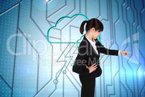 Composite image of focused businesswoman pointing