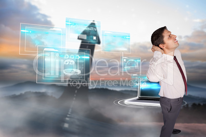 Composite image of thinking businessman scratching head