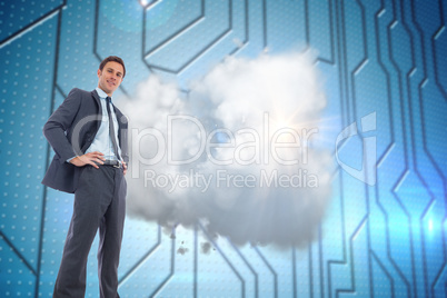 Composite image of happy businessman with hands on hips