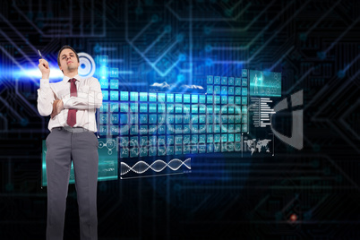 Composite image of thinking businessman holding pen