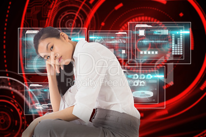 Composite image of businesswoman sitting cross legged leaning on