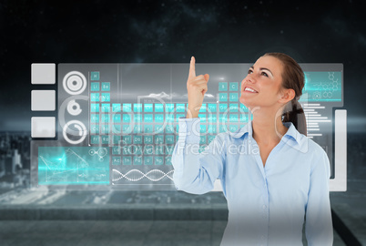 Composite image of smiling businesswoman looking and pointing up