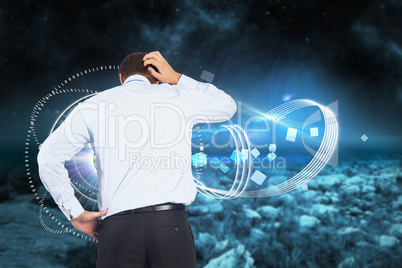 Composite image of thinking businessman scratching head