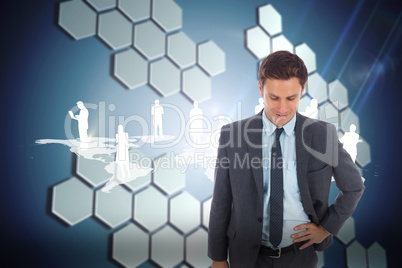 Composite image of cheerful businessman standing with hand on hi