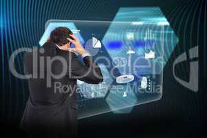 Composite image of stressed businessman with hands on head