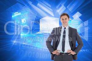 Composite image of smiling businessman with hands on hips