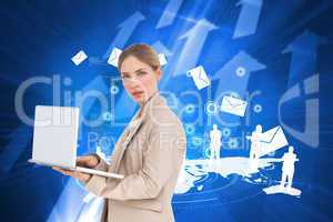 Composite image of businesswoman with a laptop