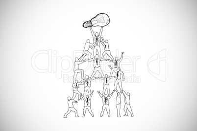 Composite image of team holding up light bulb