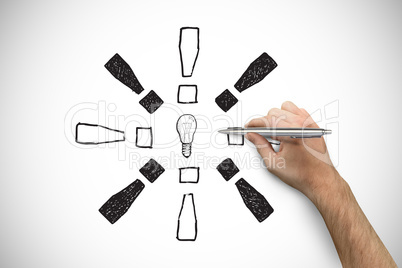 Composite image of hand holding a silver pen