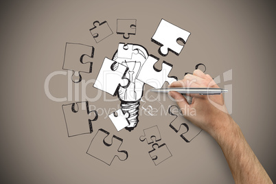 Composite image of hand holding a silver pen