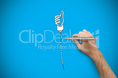 Composite image of hand holding a silver pen