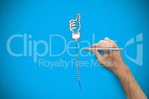 Composite image of hand holding a silver pen