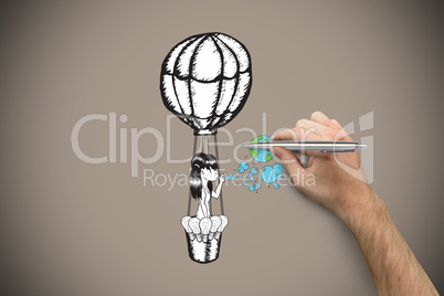 Composite image of hand holding a silver pen