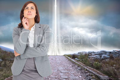 Composite image of focused businesswoman