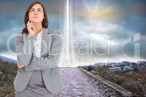 Composite image of focused businesswoman