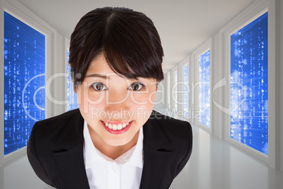 Composite image of businesswoman smiling