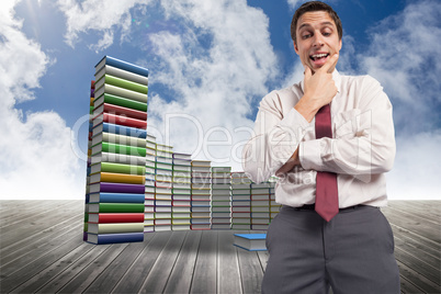 Composite image of thoughtful businessman with hand on chin