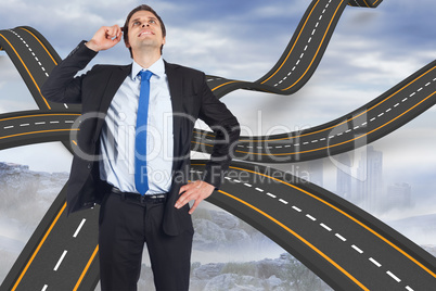 Composite image of thinking businessman scratching head