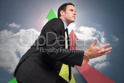 Composite image of businessman posing with arms out