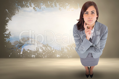 Composite image of focused businesswoman