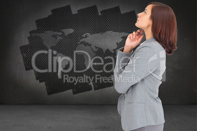 Composite image of concentrating businesswoman