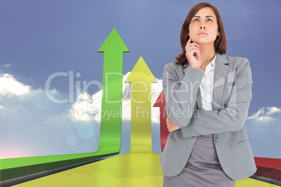 Composite image of focused businesswoman