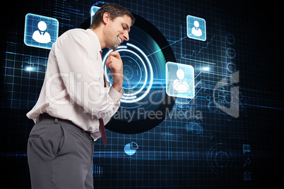 Composite image of thoughtful businessman holding pen to chin