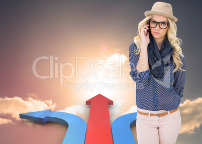 Composite image of serious trendy blonde on the phone