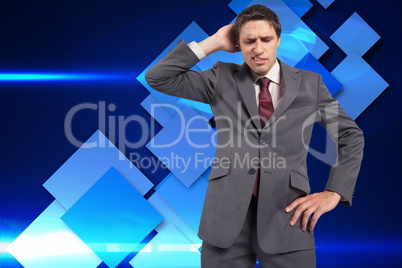 Composite image of thinking businessman scratching head