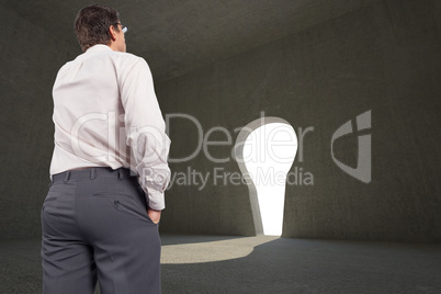 Composite image of thinking businessman touching his glasses