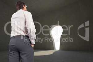 Composite image of thinking businessman touching his glasses