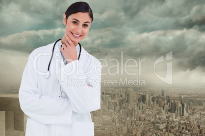Composite image of smiling female doctor in thinkers pose