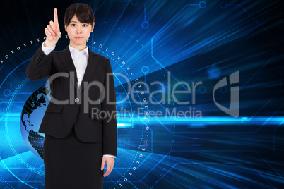 Composite image of focused businesswoman pointing