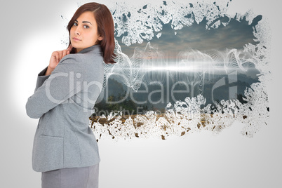 Composite image of concentrating businesswoman