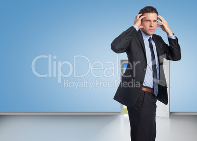 Composite image of stressed businessman with hands on head