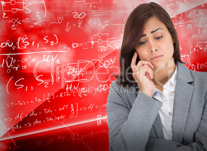 Composite image of worried businesswoman