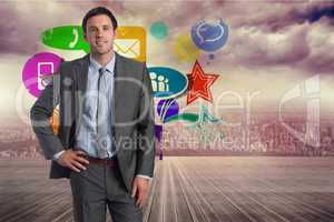 Composite image of smiling businessman with hand on hip