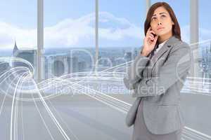 Composite image of thinking businesswoman