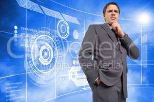 Composite image of thoughtful businessman with hand on chin