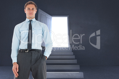 Composite image of serious businessman standing with hand in poc