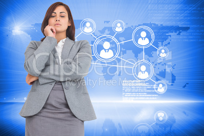 Composite image of focused businesswoman