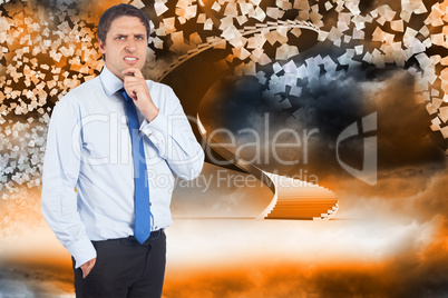 Composite image of thinking businessman touching his chin