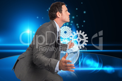 Composite image of businessman posing with hands out