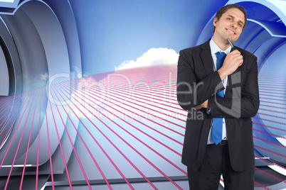 Composite image of thinking businessman holding pen