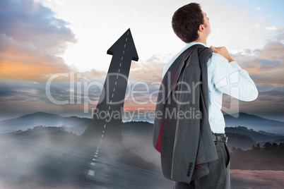 Composite image of businessman holding his jacket